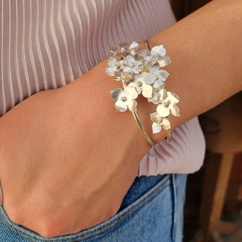 bracelet with flowers on a hand in a pocket